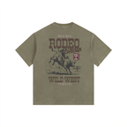 Back view of an Army Green Heavyweight Boxy T-Shirt featuring a vintage white "Wild West Rodeo Show" graphic.