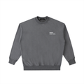 Front view of a boxy, dark grey heavyweight sweatshirt from LIKE A GIRL CLUB with a premium vintage wash.