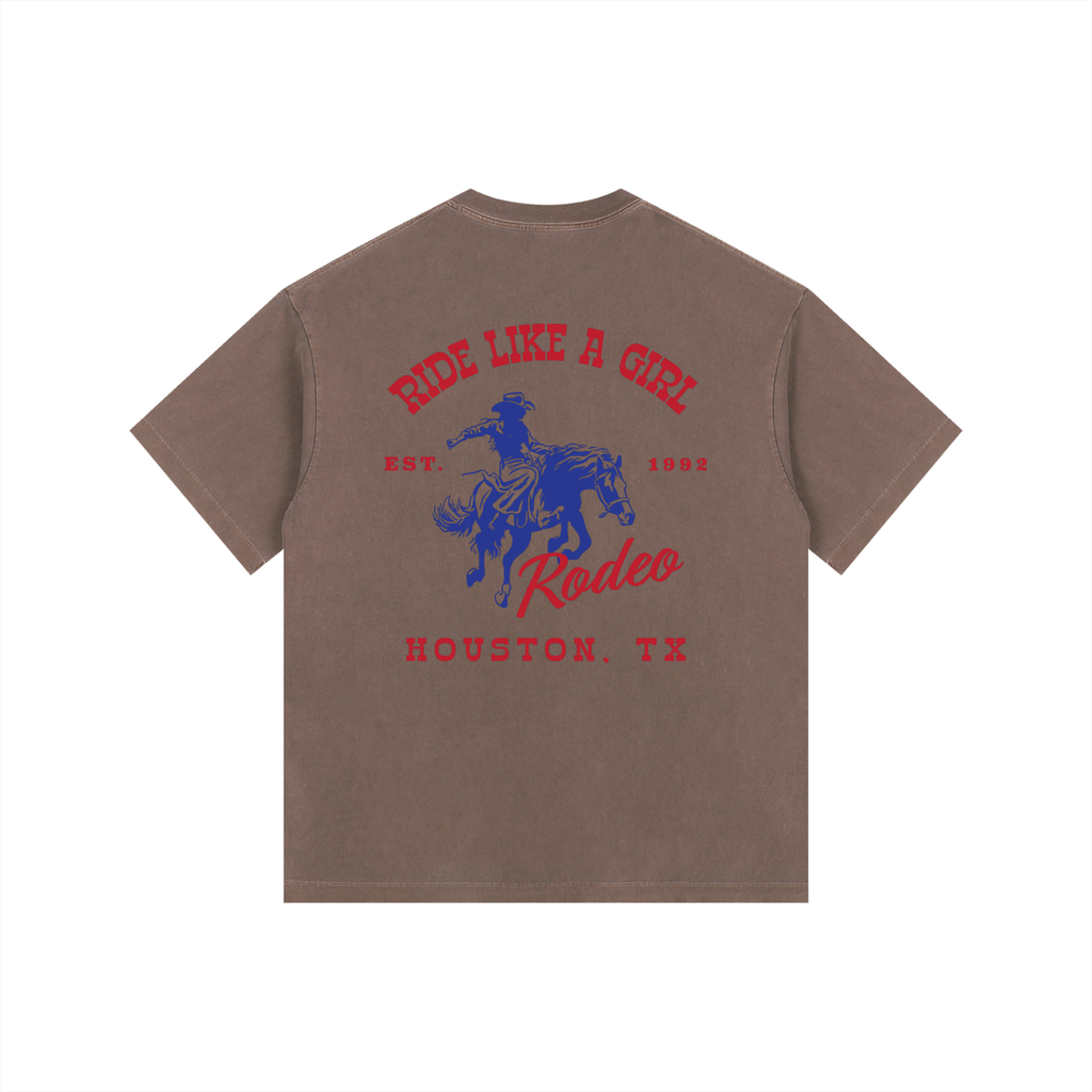 Back view of a Coffee Brown Heavyweight Boxy T-Shirt with a red and blue Houston TX Rodeo "Ride Like A Girl" graphic.
