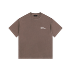 Front view of a boxy, coffee brown heavyweight t-shirt from LIKE A GIRL CLUB with a thick crew neck collar.