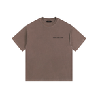 Front view of a boxy coffee brown heavyweight t-shirt from LIKE A GIRL CLUB with a structured streetwear fit.