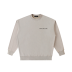 Front view of a boxy off-white heavyweight sweatshirt from LIKE A GIRL CLUB with a premium streetwear fit.