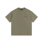Front view of a boxy army green heavyweight t-shirt from LIKE A GIRL CLUB with a structured streetwear fit.