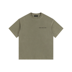 Front view of a boxy army green heavyweight t-shirt from LIKE A GIRL CLUB with a structured streetwear fit.